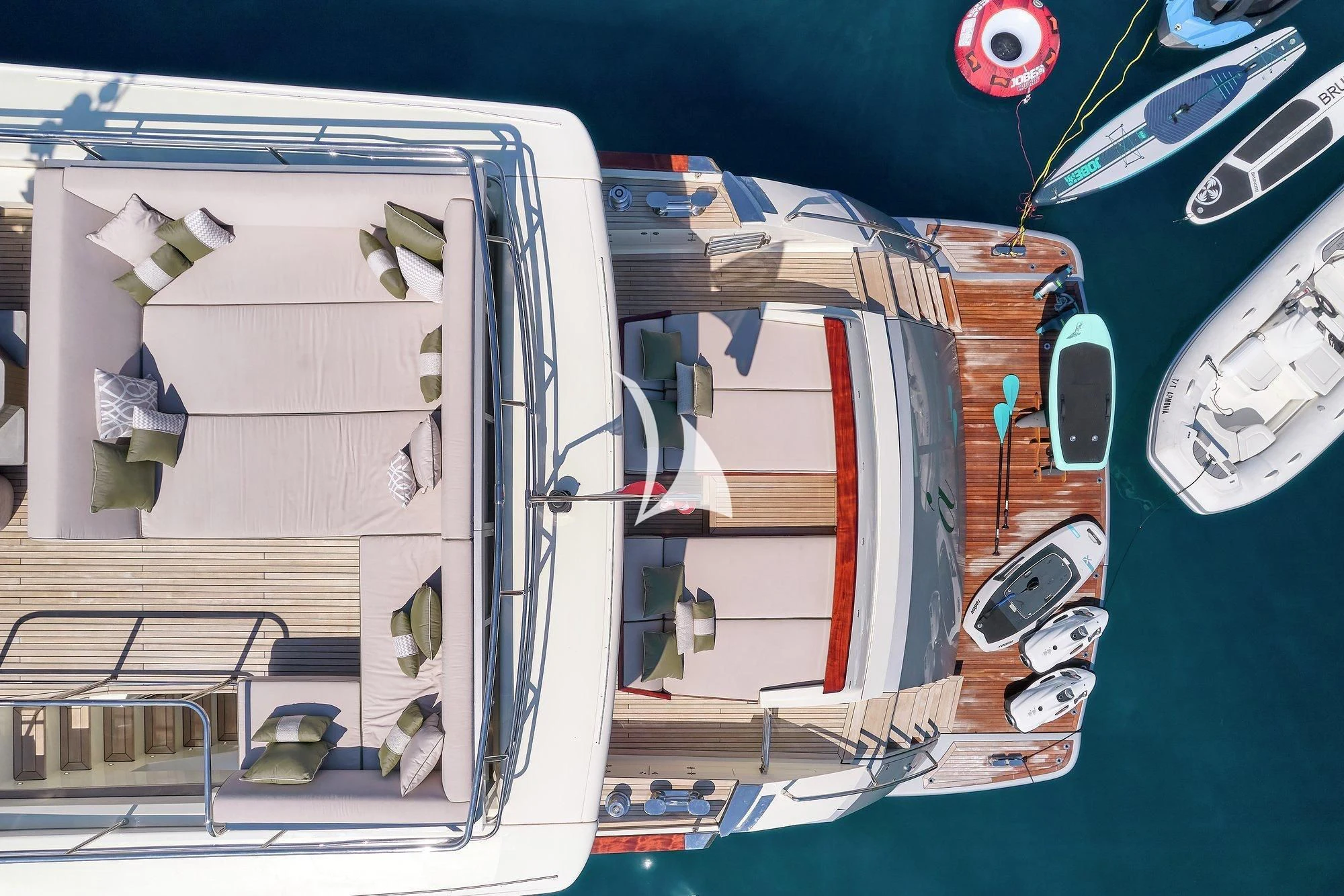 a large vehicle with a red and white stripe aboard APMONIA Yacht for Sale