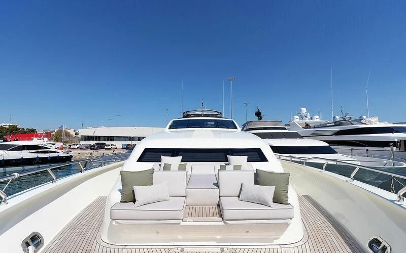 a white lounge chair on a boat aboard APMONIA Yacht for Sale