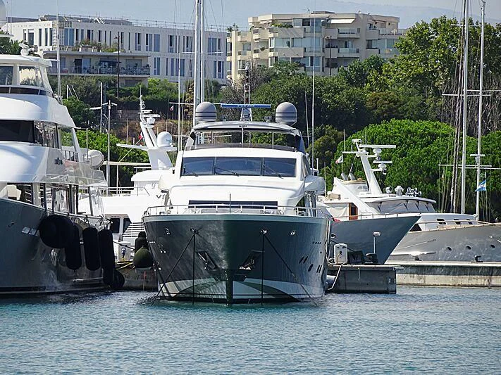 a group of boats are parked in a harbor aboard APMONIA Yacht for Sale