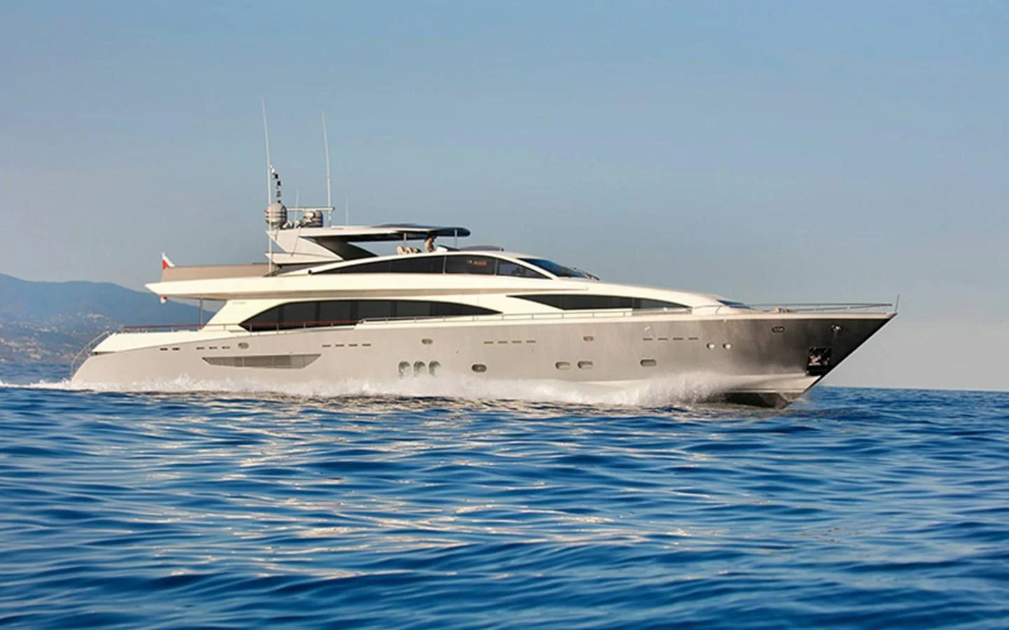 a white yacht in the water aboard APMONIA Yacht for Sale