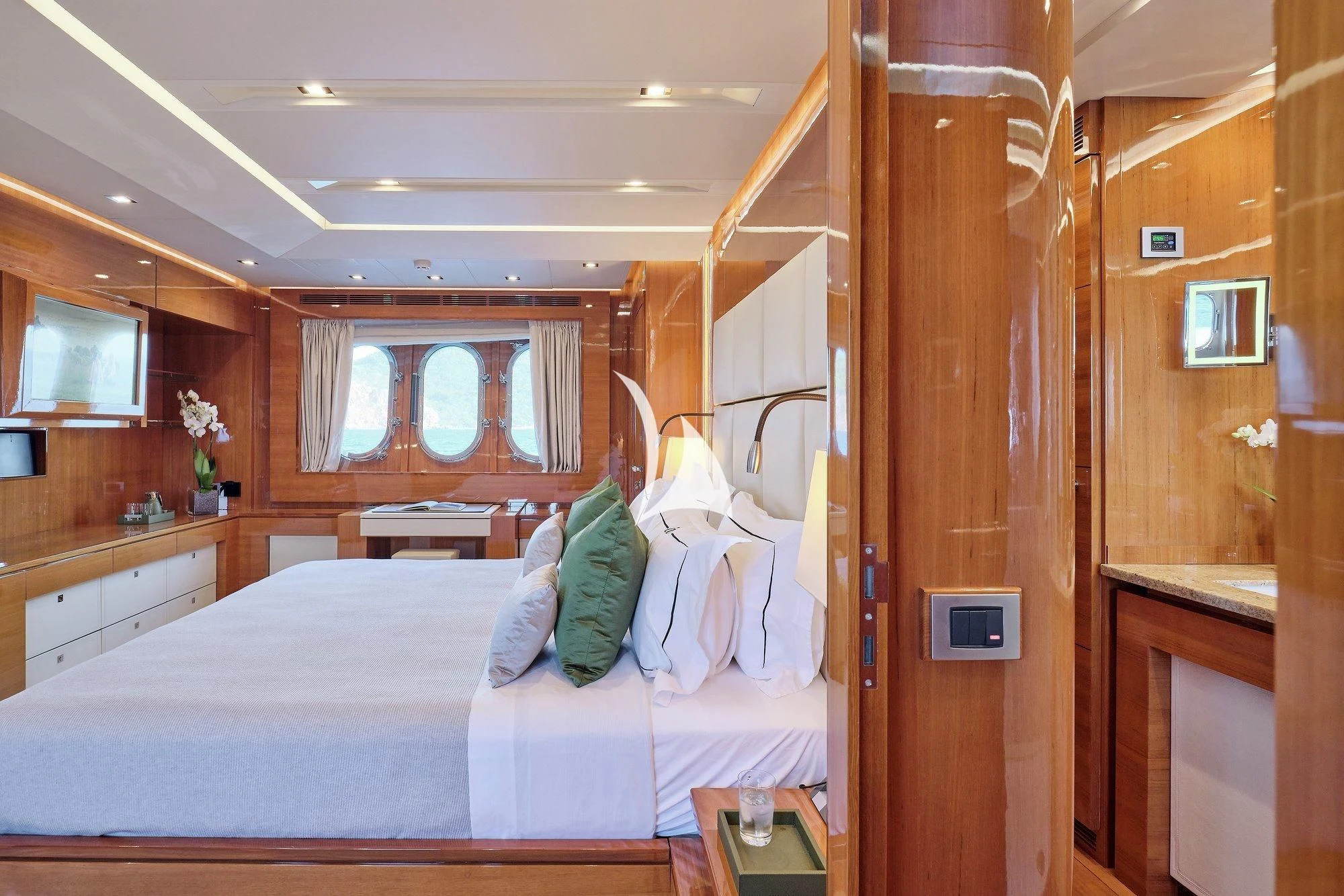 a bedroom with a bed and a closet aboard APMONIA Yacht for Sale