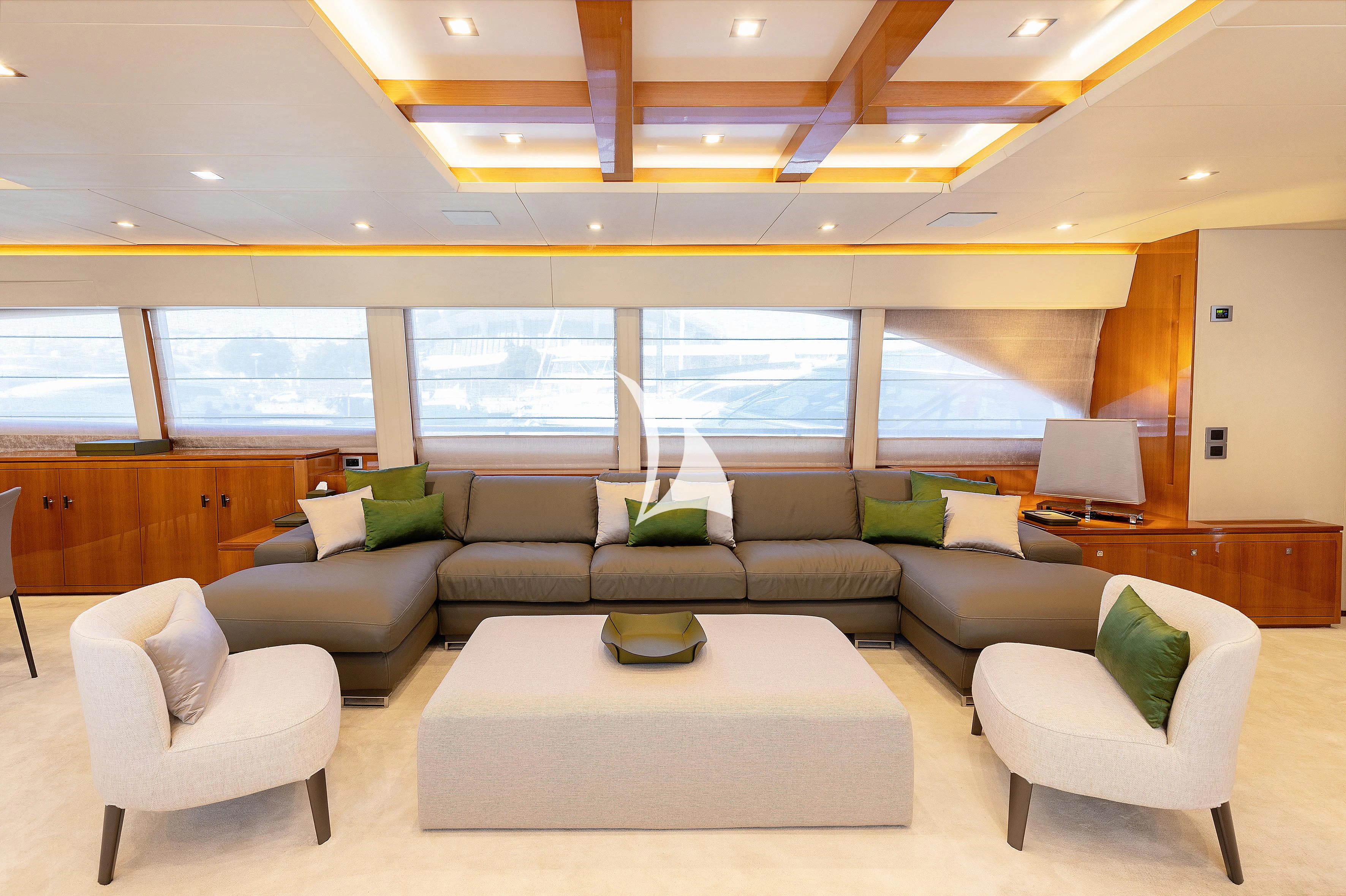 a room with couches and a table aboard APMONIA Yacht for Sale
