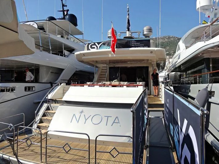 a boat docked at a pier aboard APMONIA Yacht for Sale