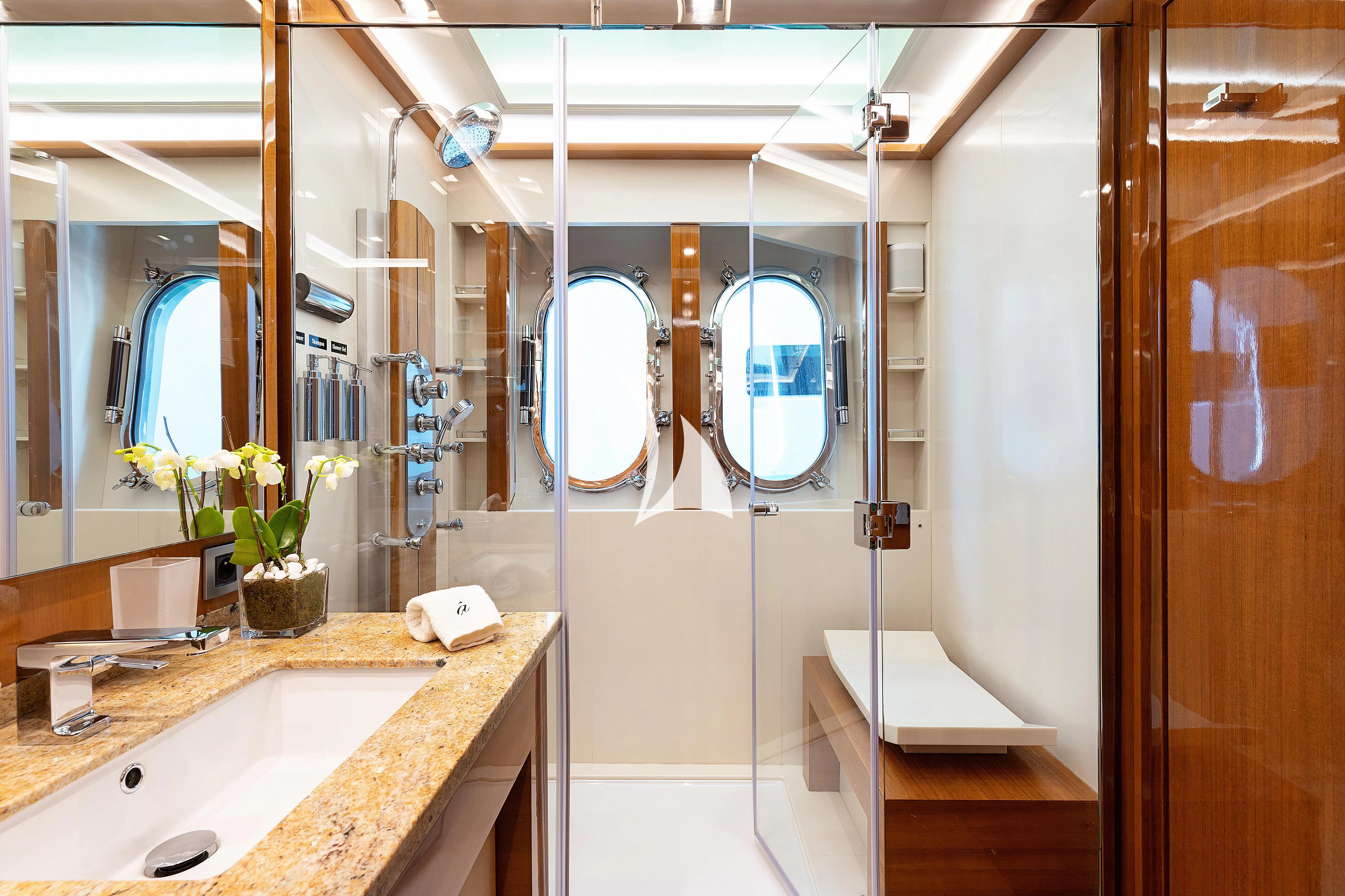 a bathroom with a sink and a mirror aboard APMONIA Yacht for Sale