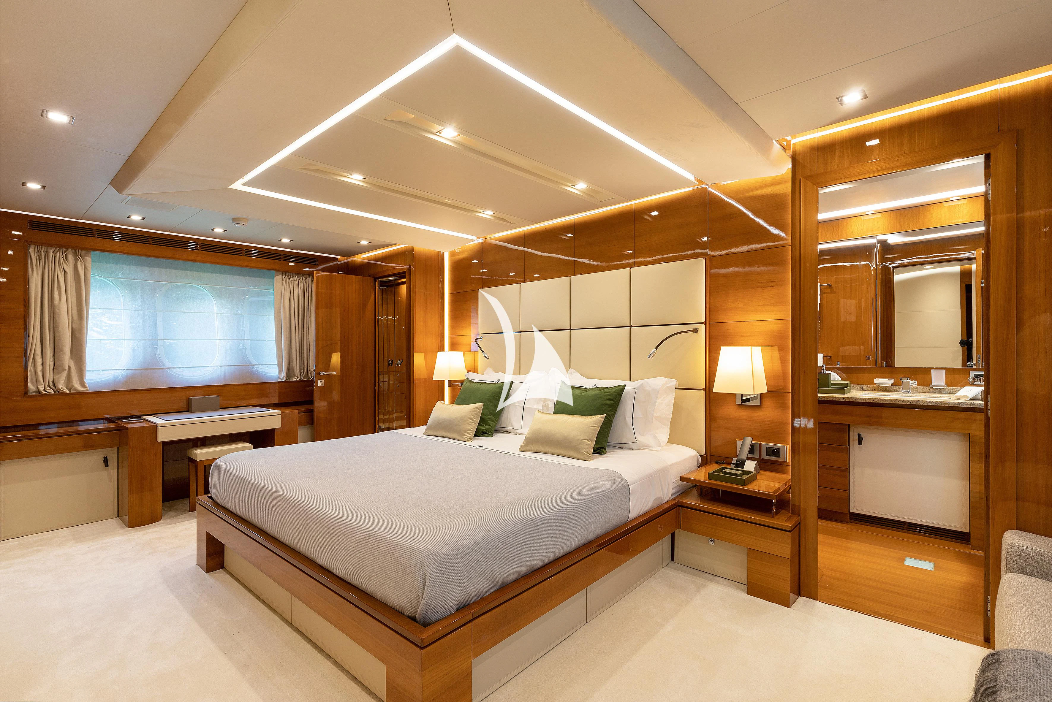 a hotel room with a bed aboard APMONIA Yacht for Sale
