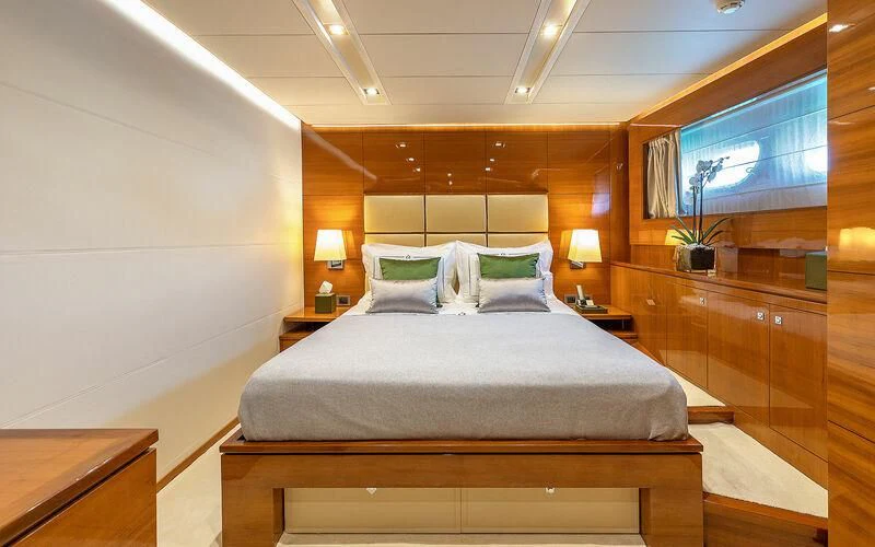 a bed in a room aboard APMONIA Yacht for Sale