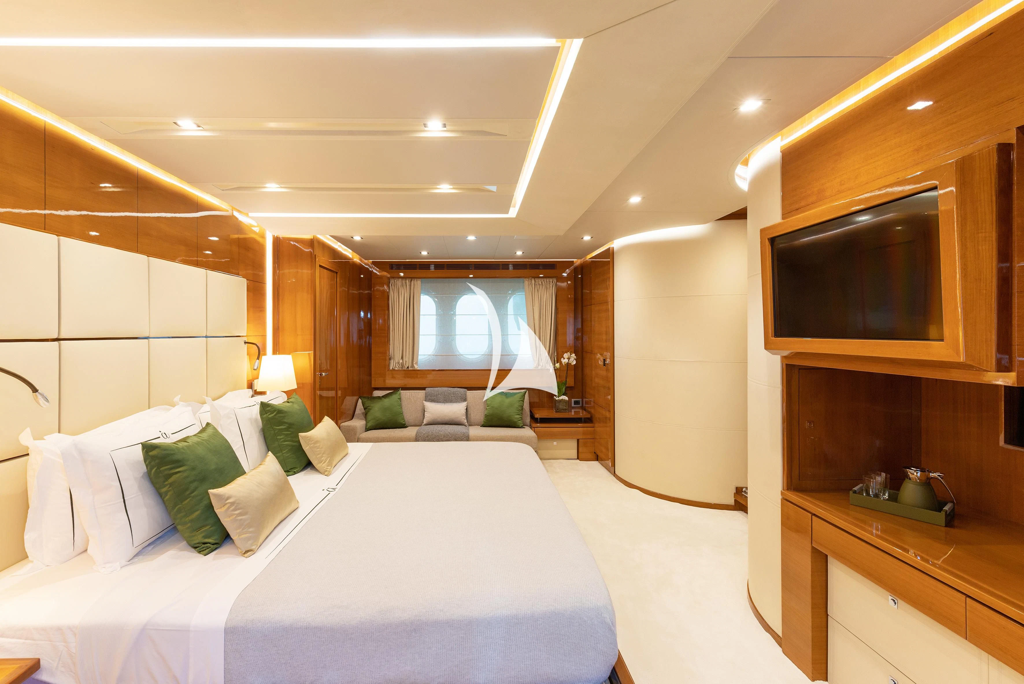 a room with a bed and a television aboard APMONIA Yacht for Sale