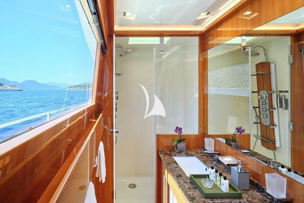 a room with a counter and a sink and a window aboard APMONIA Yacht for Sale