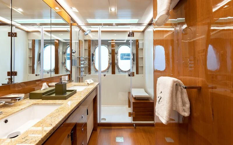 a bathroom with a sink and a mirror aboard APMONIA Yacht for Sale