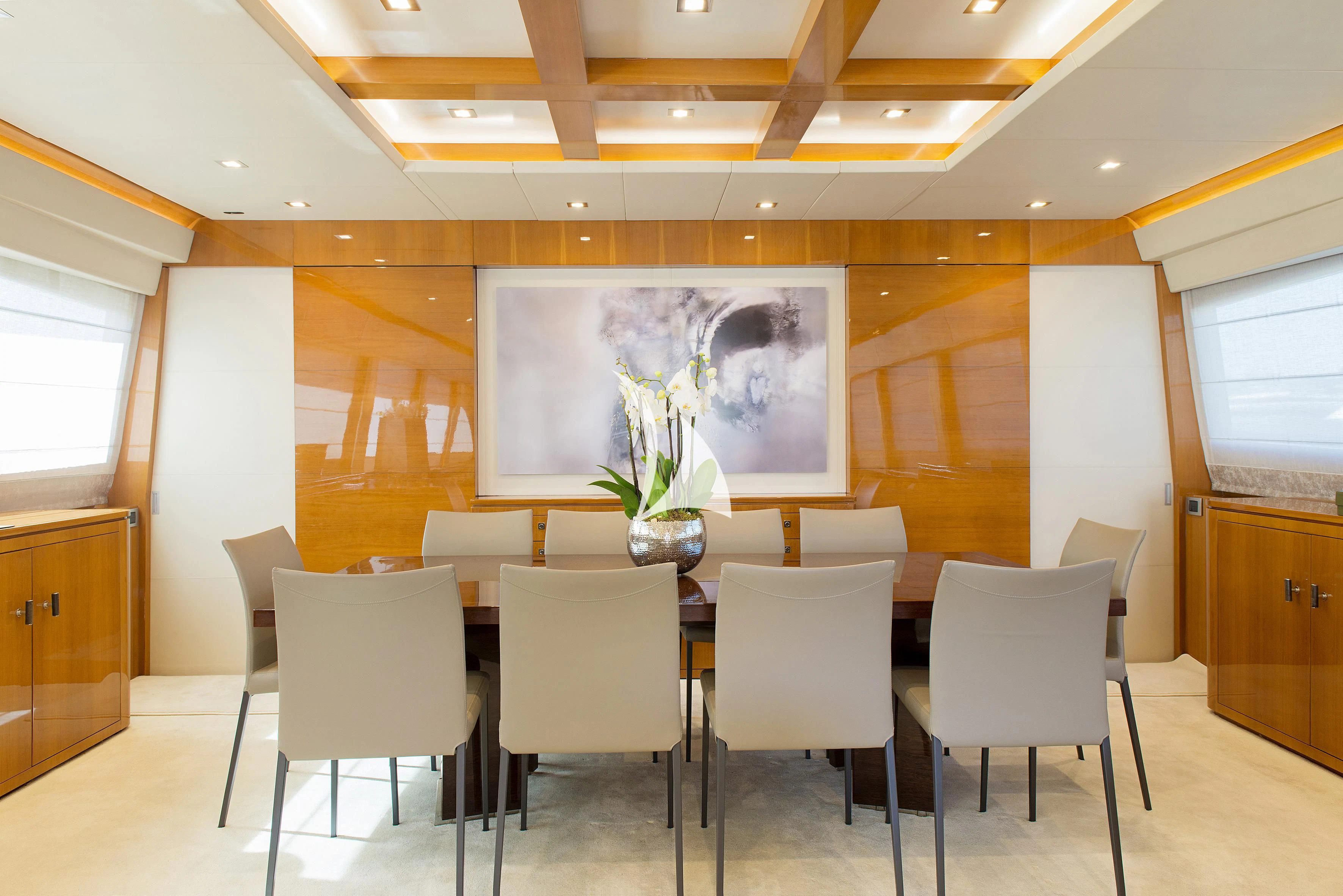 a room with a table and chairs aboard APMONIA Yacht for Sale