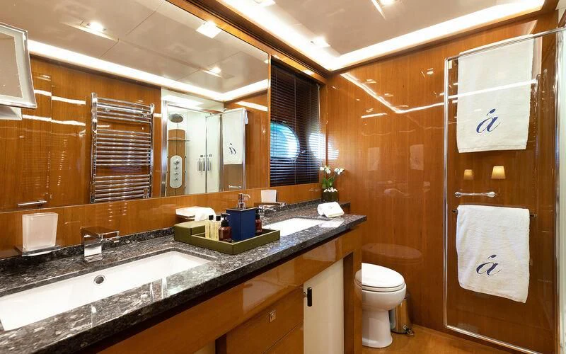 a bathroom with a sink and a toilet aboard APMONIA Yacht for Sale