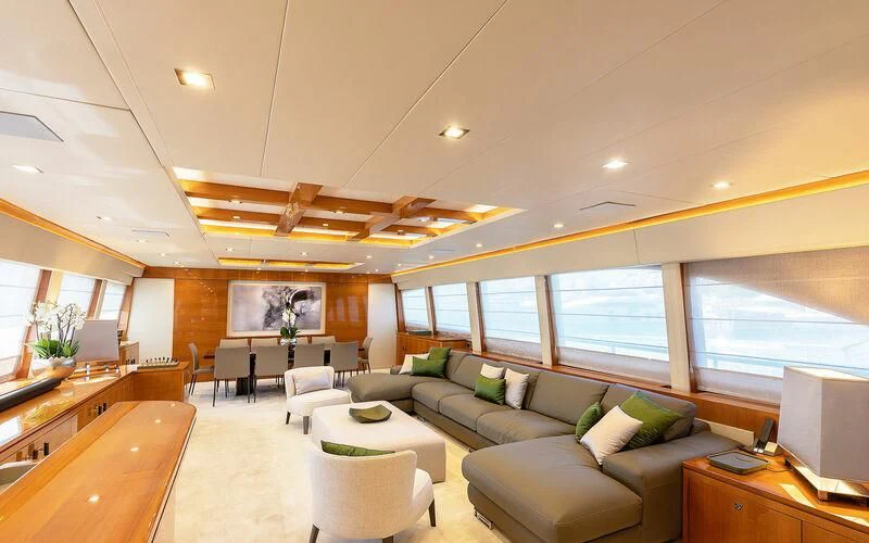 a living room with a couch and a table aboard APMONIA Yacht for Sale