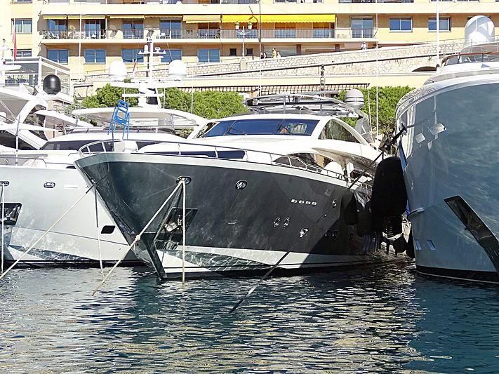 a group of boats in a harbor aboard APMONIA Yacht for Sale