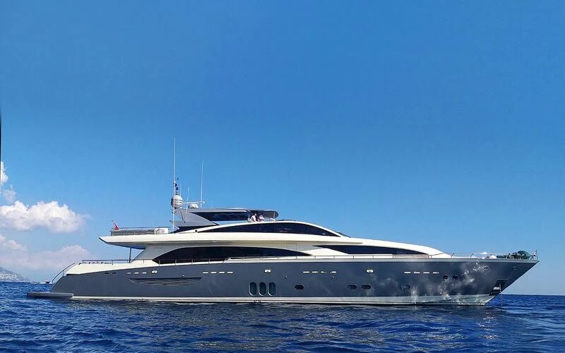 a white yacht on the water aboard APMONIA Yacht for Sale