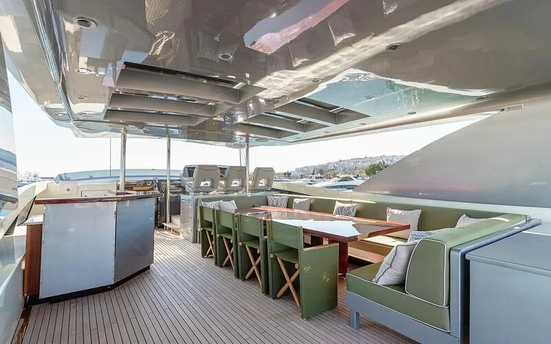 a boat with many seats aboard APMONIA Yacht for Sale