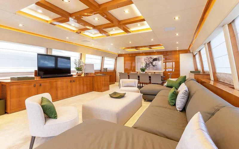 a living room with a large tv aboard APMONIA Yacht for Sale