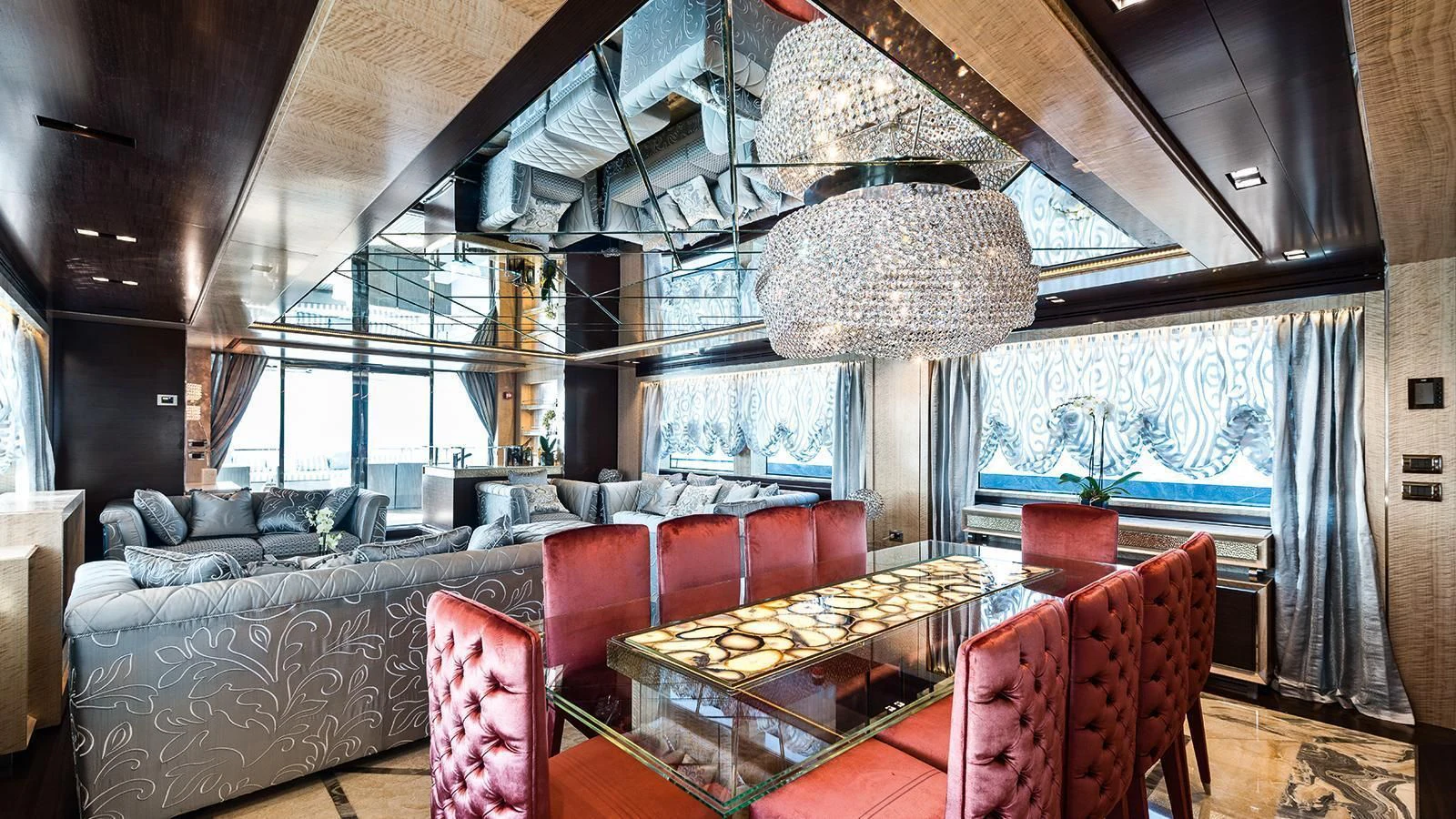 a room with a couch and a table and chairs aboard MODUS Yacht for Sale