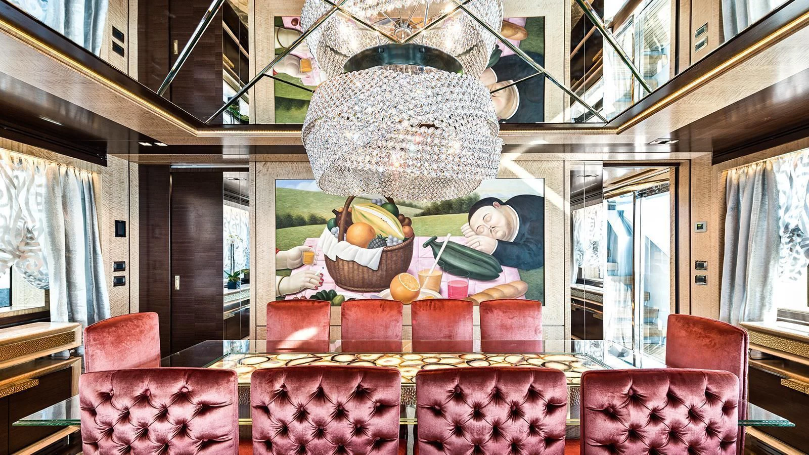 a table with a large stack of food on it aboard MODUS Yacht for Sale