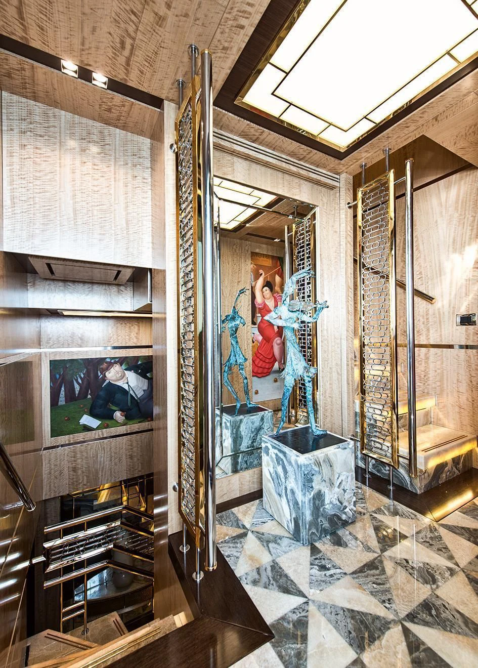 a room with a mirror and a painting on the wall aboard MODUS Yacht for Sale