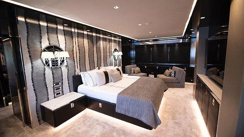 a bedroom with a bed and a couch aboard MODUS Yacht for Sale
