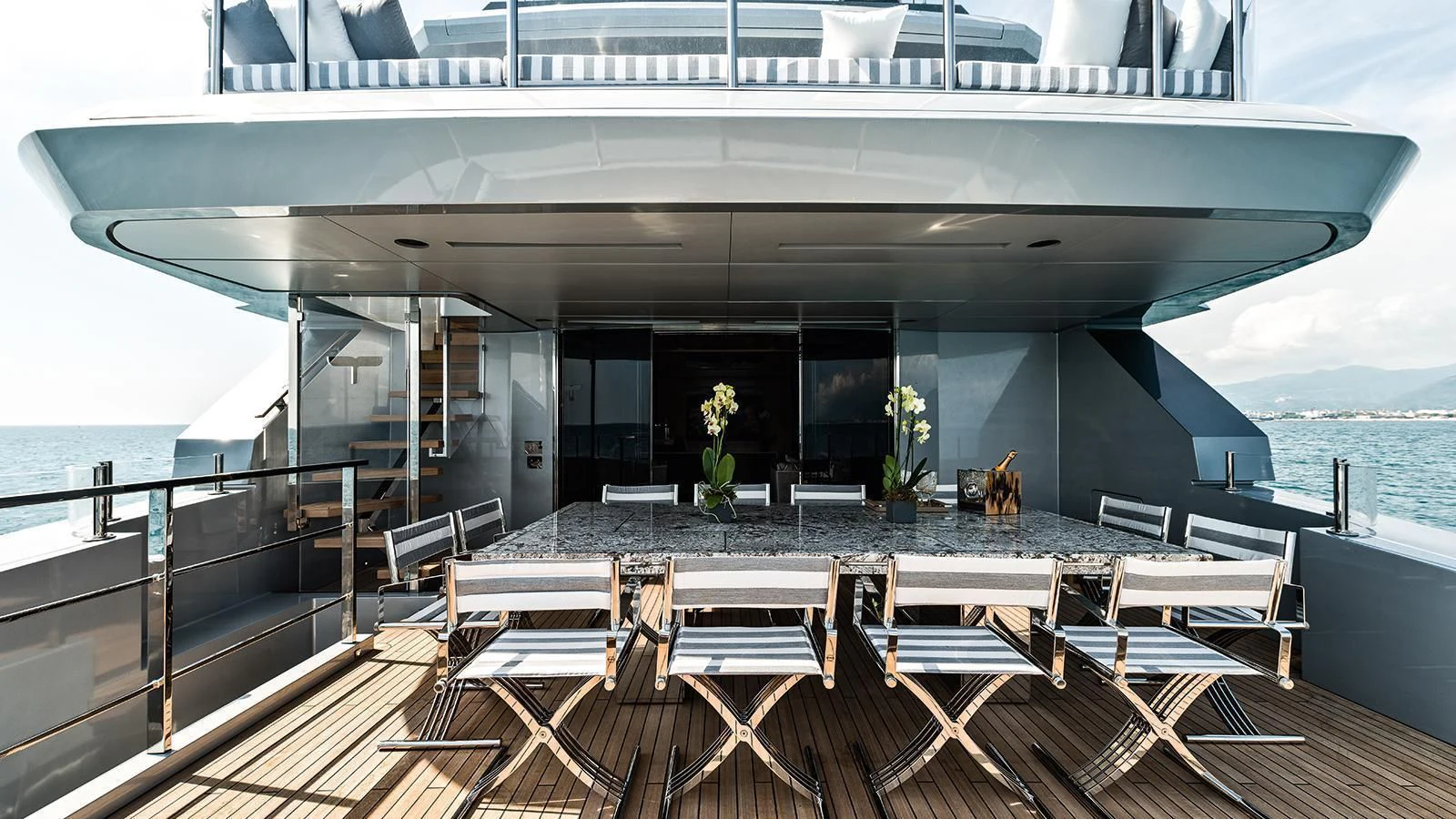 a large patio with a large balcony overlooking the ocean aboard MODUS Yacht for Sale