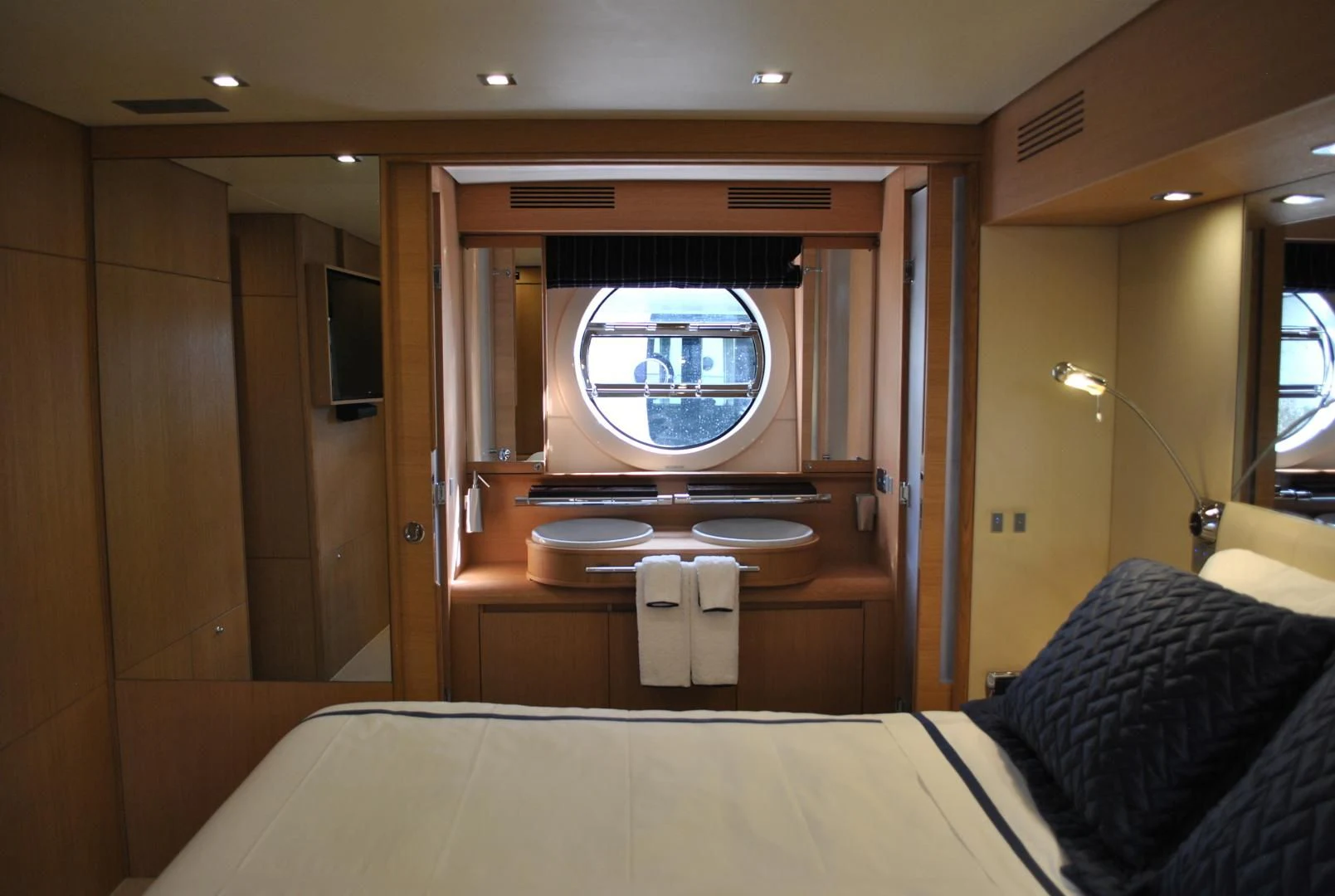 a room with a bed and a window aboard KRYSKAR Yacht for Sale
