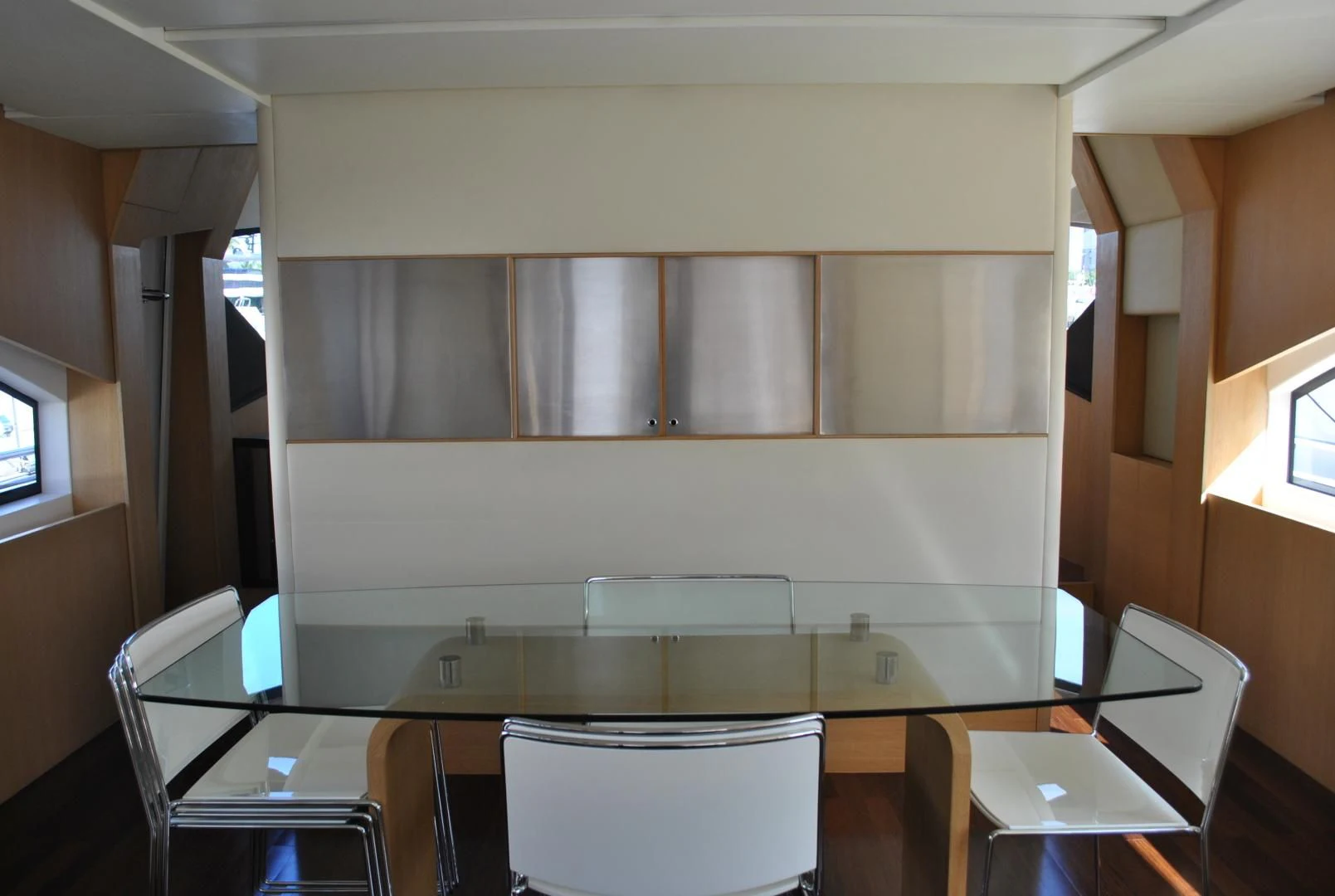 a room with chairs and tables aboard KRYSKAR Yacht for Sale