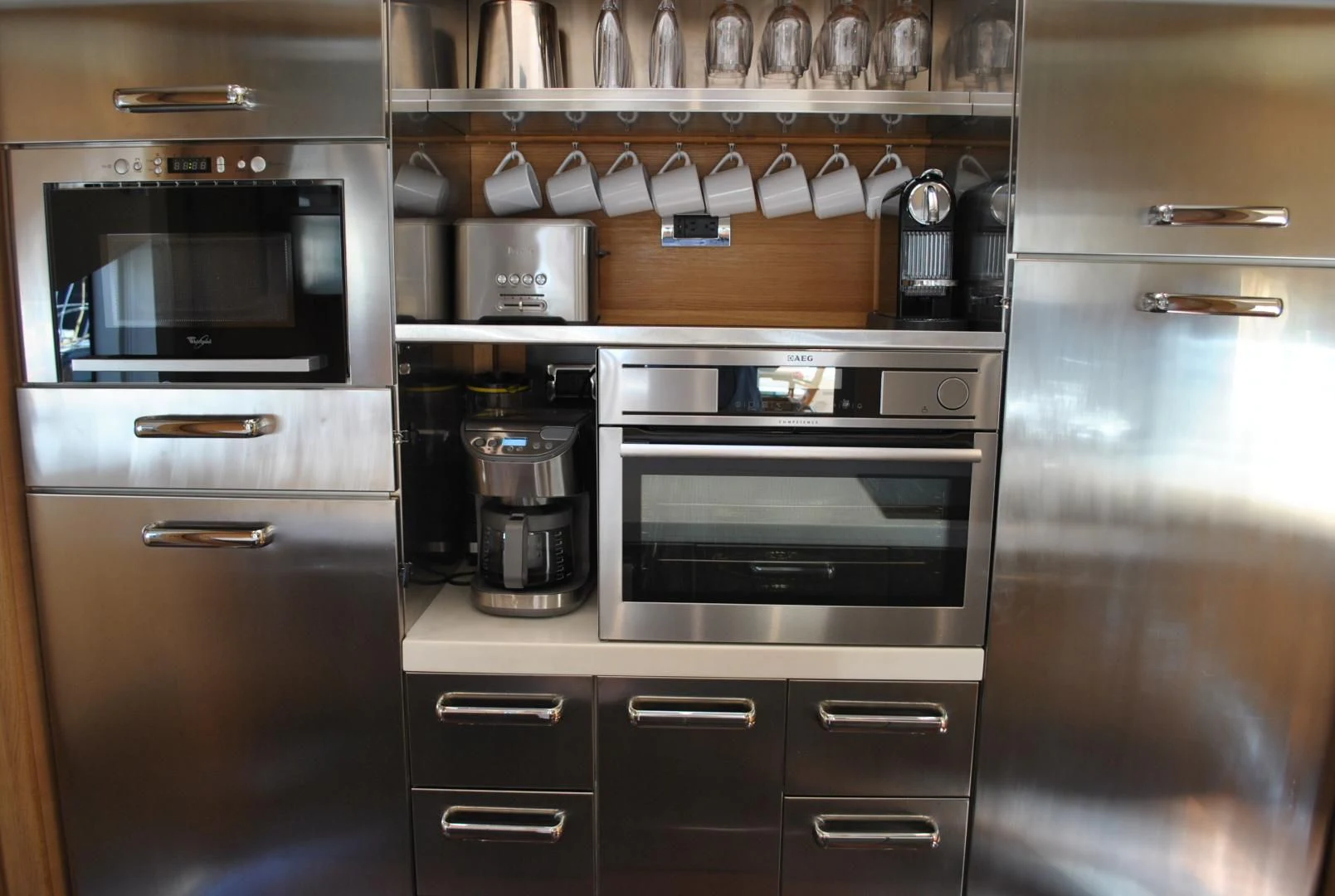 a kitchen with stainless steel appliances aboard KRYSKAR Yacht for Sale