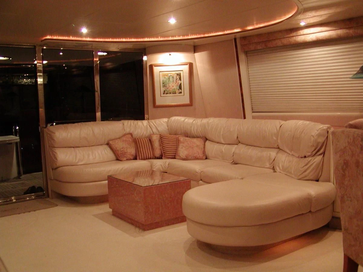 a living room with a couch aboard COMPANIONSHIP Yacht for Sale