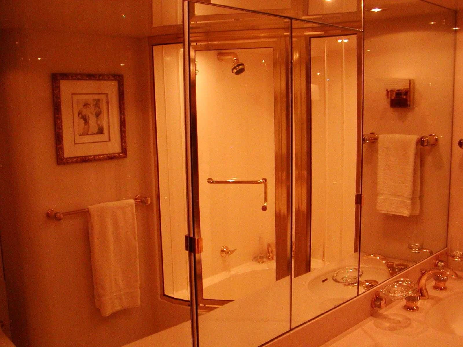 a bathroom with a glass shower aboard COMPANIONSHIP Yacht for Sale