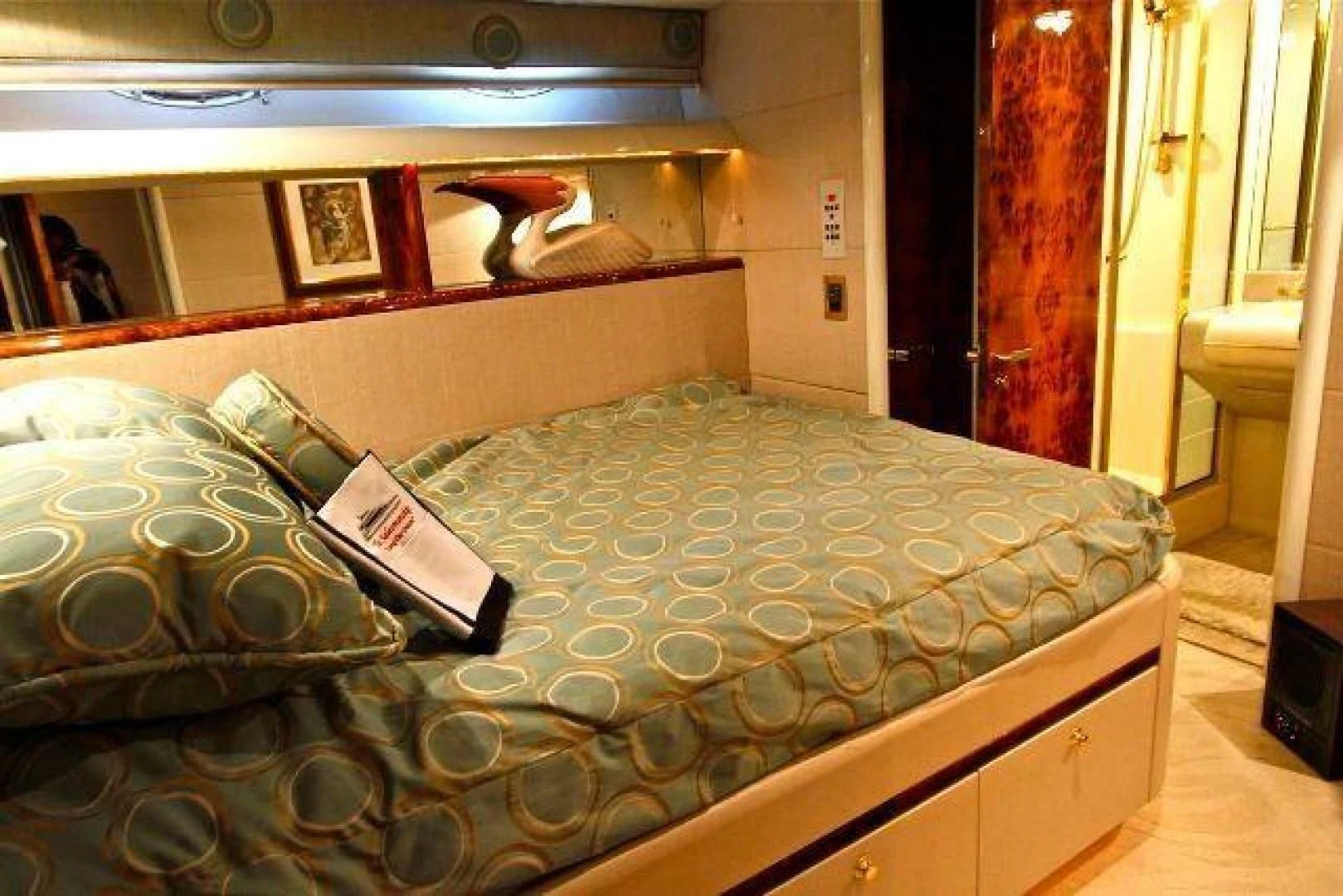 a bed with a book on it aboard COMPANIONSHIP Yacht for Sale