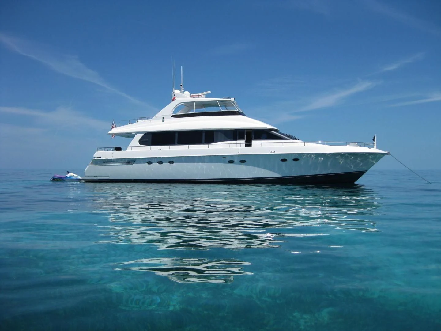 a white yacht in the water aboard COMPANIONSHIP Yacht for Sale