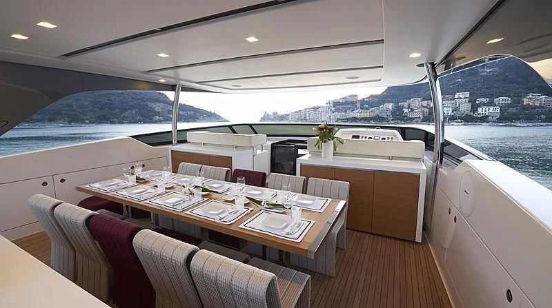 a dining table in a room aboard BELLA ITALIA Yacht for Sale