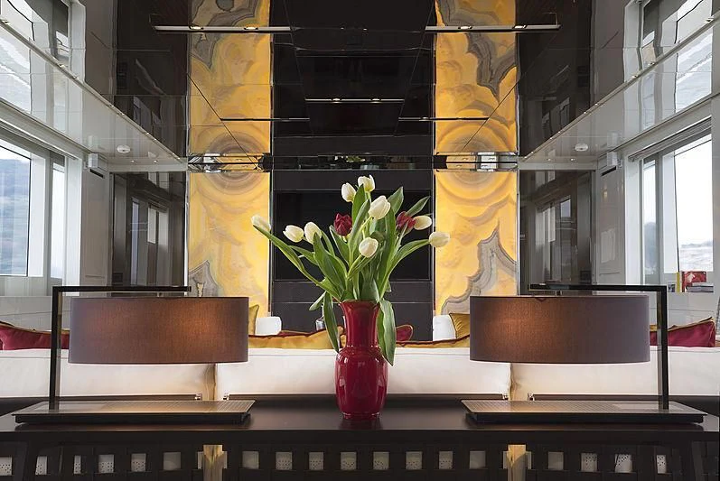 a vase of flowers sits on a desk aboard BELLA ITALIA Yacht for Sale