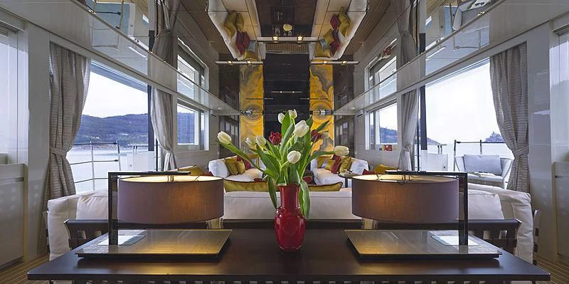 a vase of flowers on a table aboard BELLA ITALIA Yacht for Sale