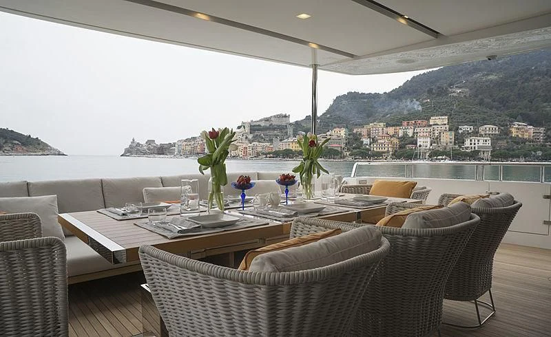 a room with a table and chairs aboard BELLA ITALIA Yacht for Sale