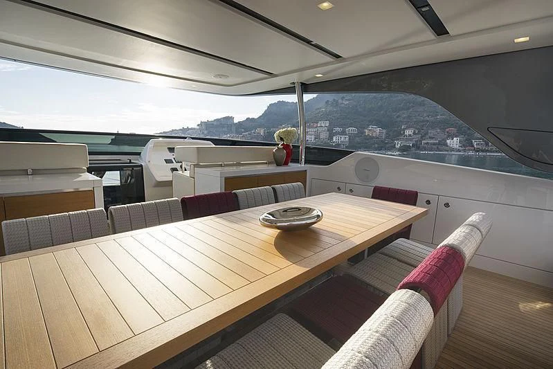 a boat with a table and chairs aboard BELLA ITALIA Yacht for Sale