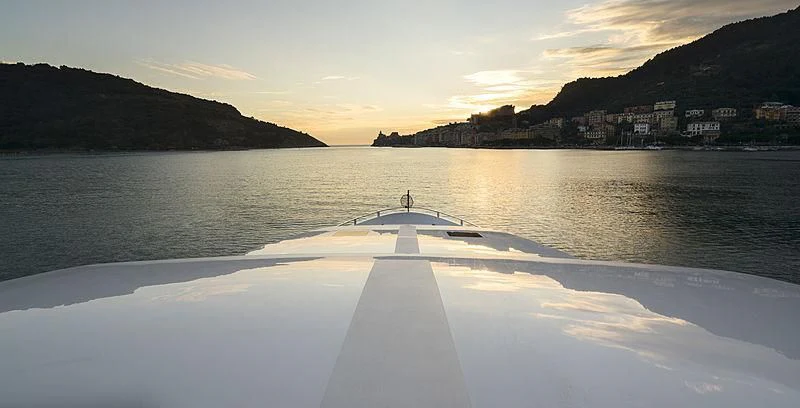 a person standing on a dock in the water aboard BELLA ITALIA Yacht for Sale