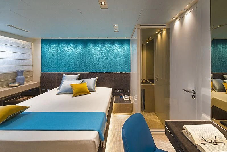 a room with a bed and a table aboard BELLA ITALIA Yacht for Sale
