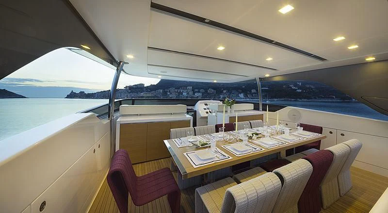 a dining table in a room aboard BELLA ITALIA Yacht for Sale