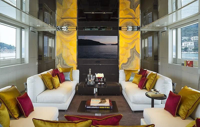 a living room with a fireplace aboard BELLA ITALIA Yacht for Sale