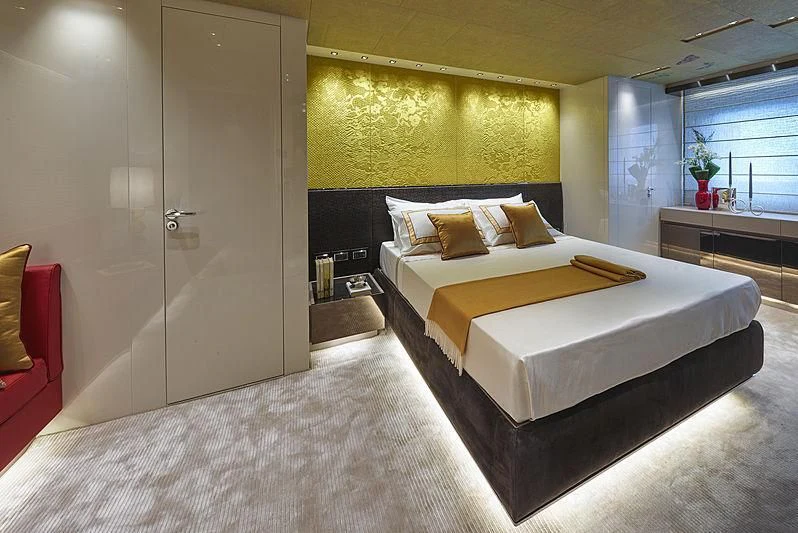 a room with a bed and a desk aboard BELLA ITALIA Yacht for Sale