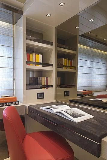 a room with a bookcase and a desk aboard BELLA ITALIA Yacht for Sale