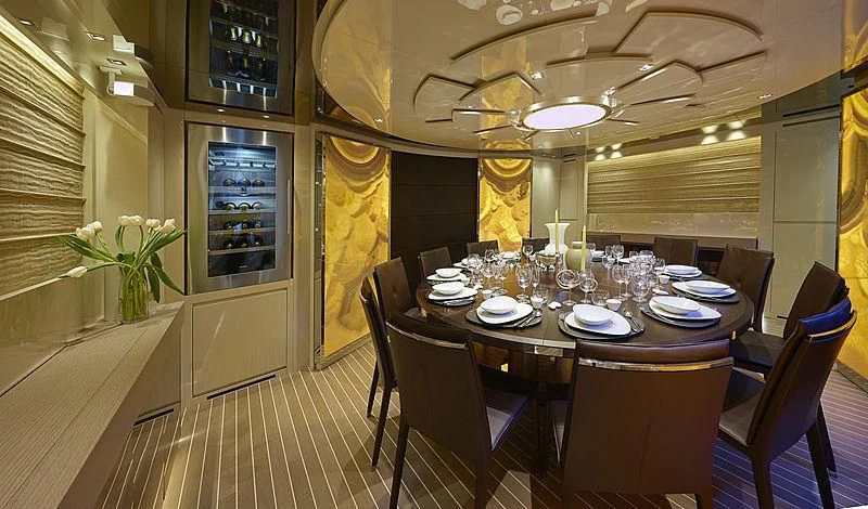 a dining room with a table and chairs aboard BELLA ITALIA Yacht for Sale