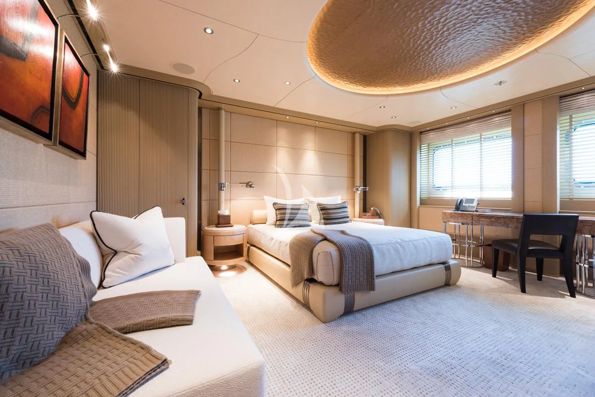 a room with a bed and a table aboard ROMEA Yacht for Sale