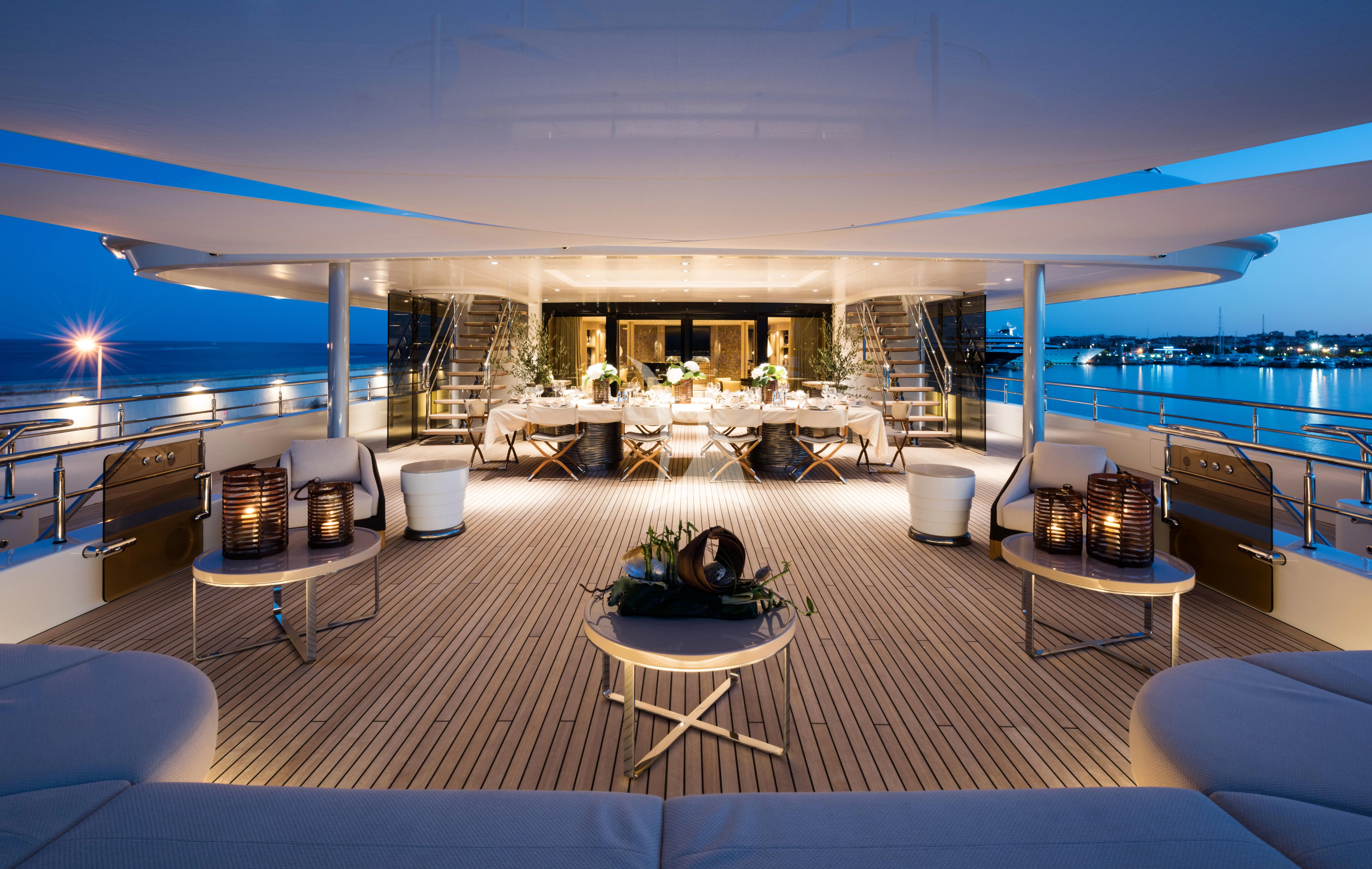 a room with a view of the water and the deck aboard ROMEA Yacht for Sale