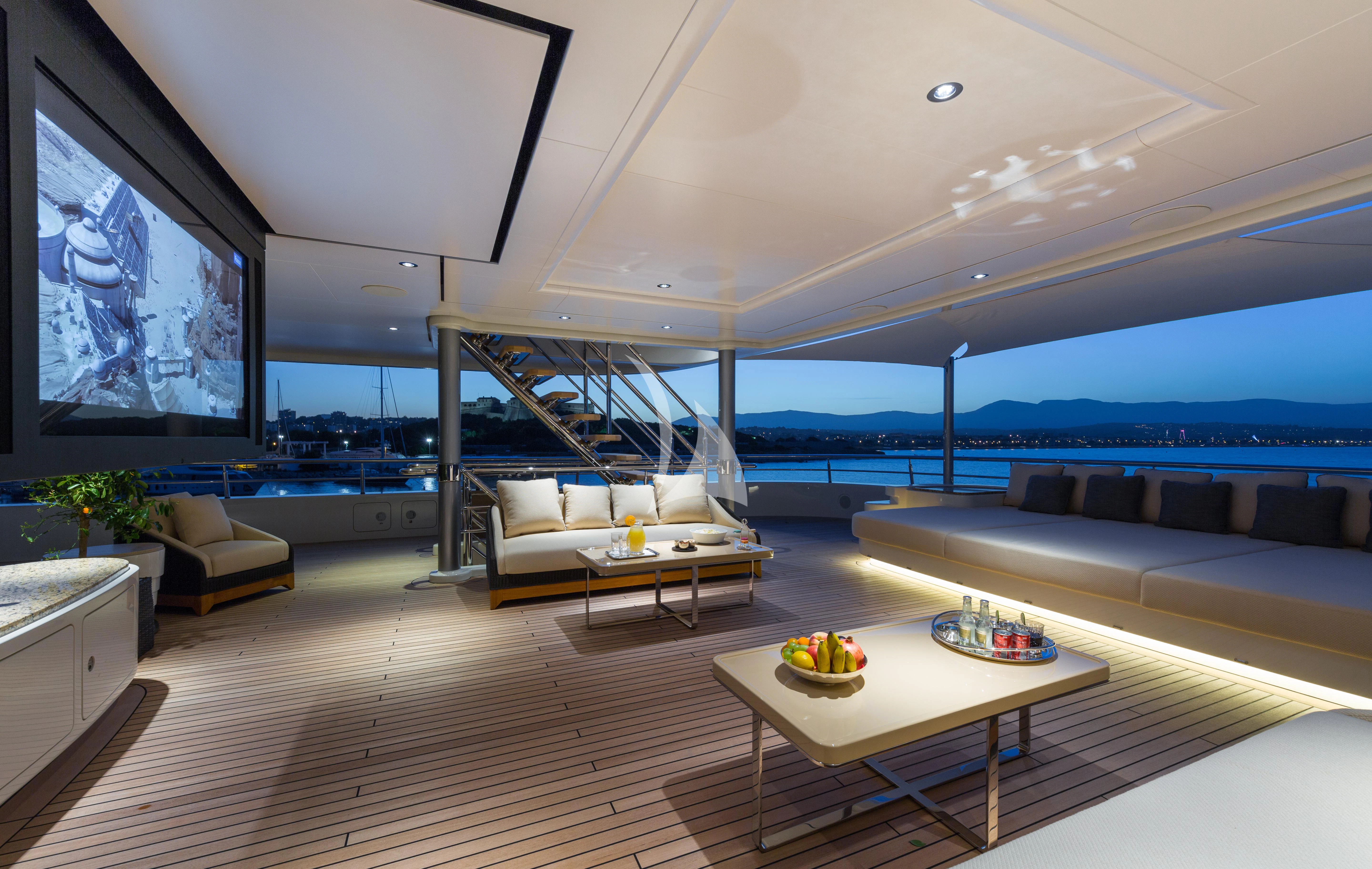 a living room with a large window overlooking the ocean aboard ROMEA Yacht for Sale