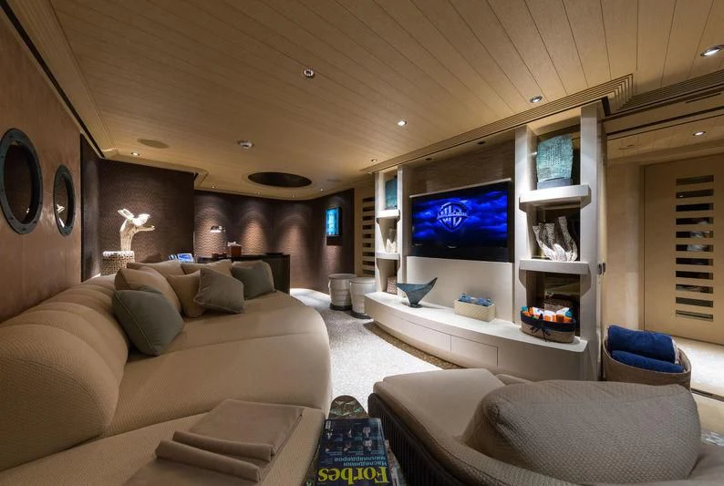 a living room with a large screen aboard ROMEA Yacht for Sale