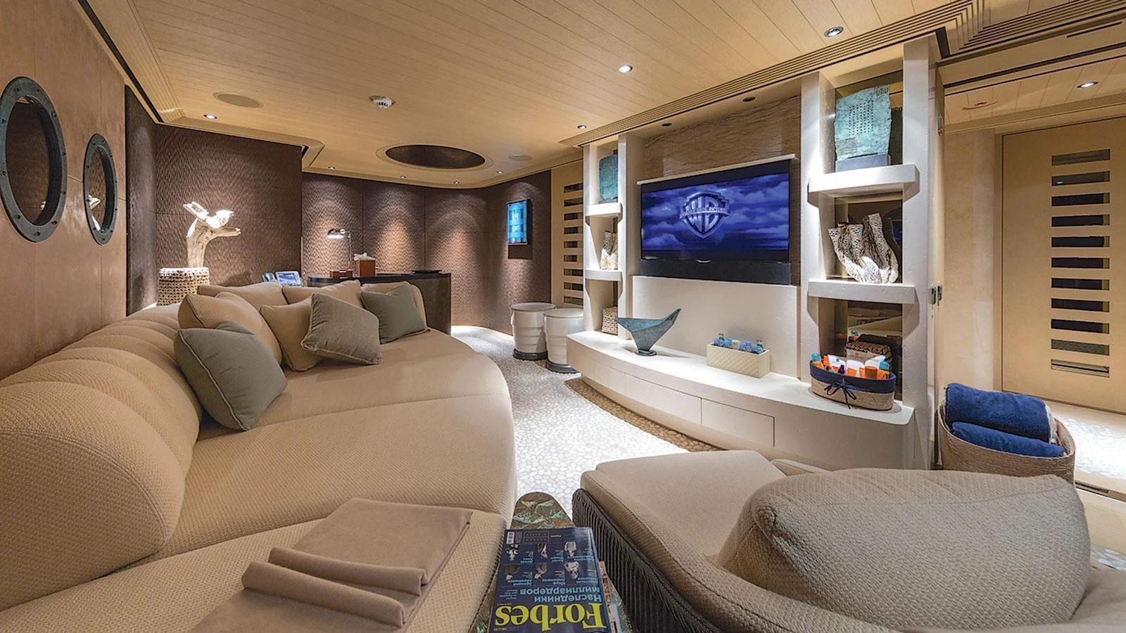 a living room with a large screen aboard ROMEA Yacht for Sale