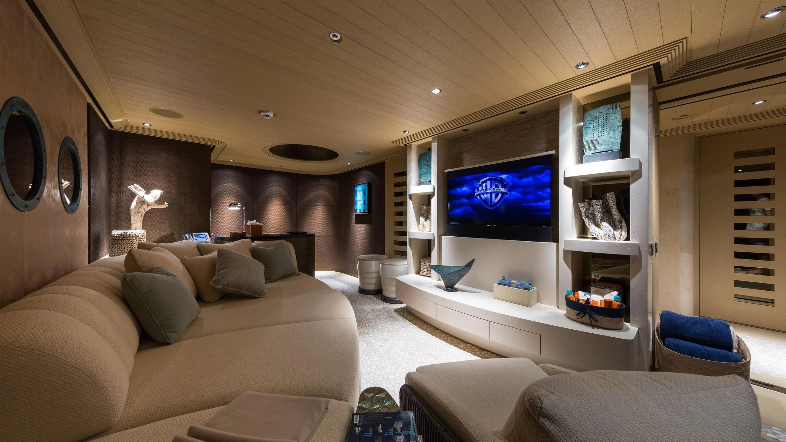a living room with a large screen aboard ROMEA Yacht for Sale